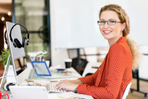 Young woman in casual clothes in an office